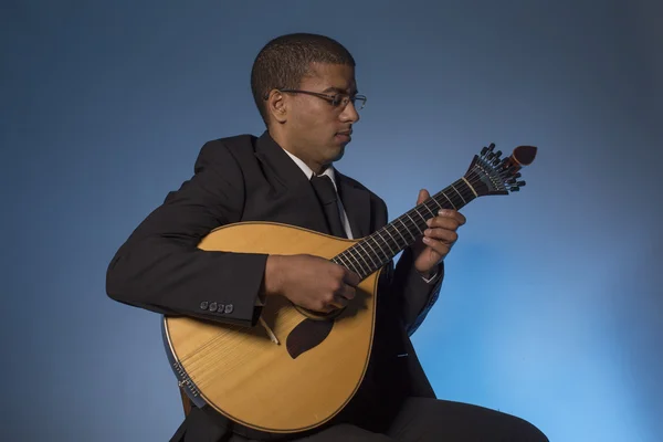 Fado musician with a portuguese guitar, studio — Stock Photo, Image