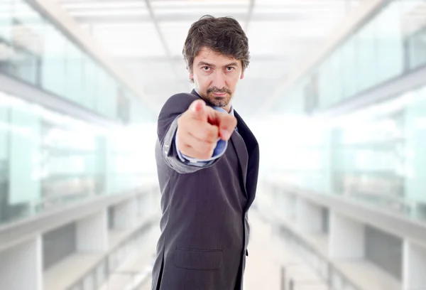 Young business man pointing, at the office — Stock Photo, Image