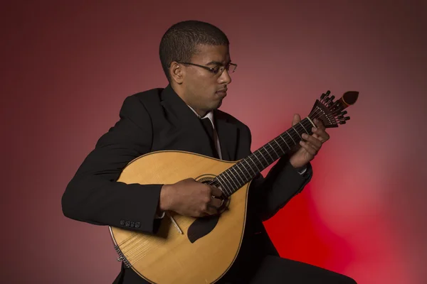 Fado musician with a portuguese guitar, studio — Stock Photo, Image