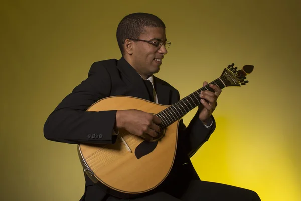 Fado musician with a portuguese guitar, studio — Stock Photo, Image