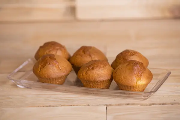 Delicious cupcakes on wooden table — Stock Photo, Image