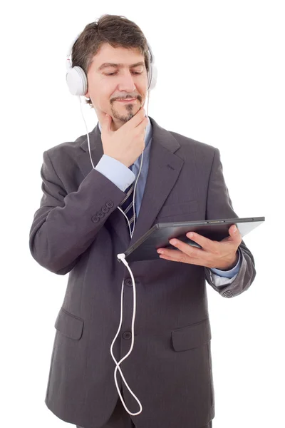 Biznesmen z tabletem i słuchawkami, izolowane — Zdjęcie stockowe