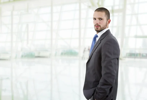 Young business man thinking, at the office — Stock Photo, Image