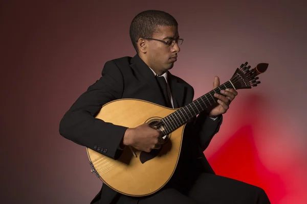 Fado musician with a portuguese guitar, studio — Stock Photo, Image