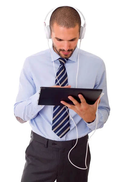Homme d'affaires avec tablette PC et écouteurs, isolé — Photo