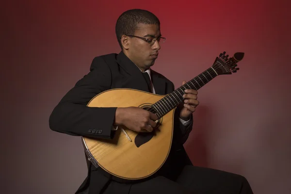 Fado musician with a portuguese guitar, studio — Stock Photo, Image