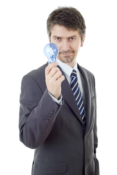 Homem de negócios tolo com uma lâmpada isolada em branco — Fotografia de Stock