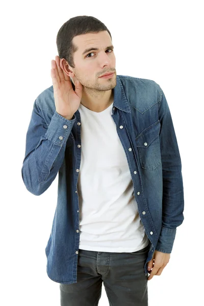 Jovem homem casual ouvindo em fundo branco — Fotografia de Stock