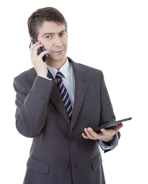 Hombre de negocios usando el cojín táctil de la PC de la tableta, en el teléfono, aislado — Foto de Stock