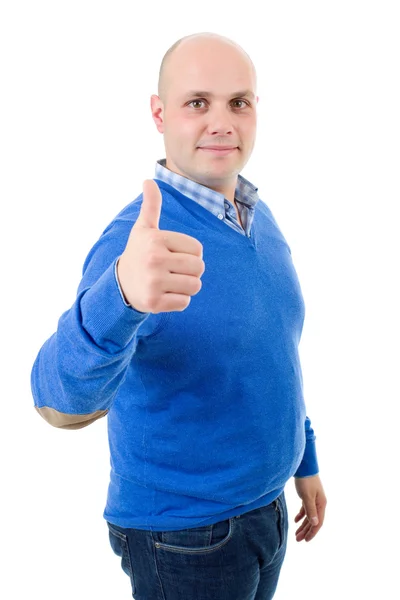 Young casual man going thumbs up, isolated on white background — Stock Photo, Image