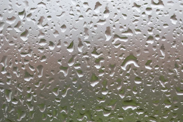 Glass surface with water drops in a rainy day — Stock Photo, Image