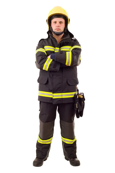 Serious firefighter posing with arms crossed. Full length studio shot isolated — Stock Photo, Image