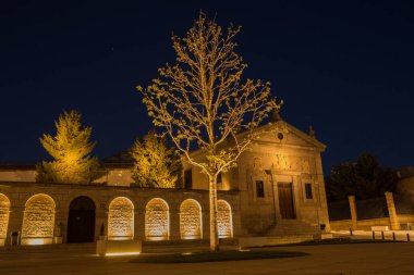 Night view of square in the front of Santa Teresa Convent in Avila, Spain clipart