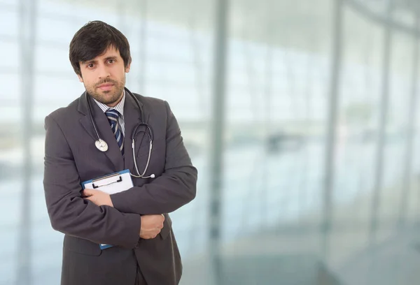 happy male doctor, at the hospital