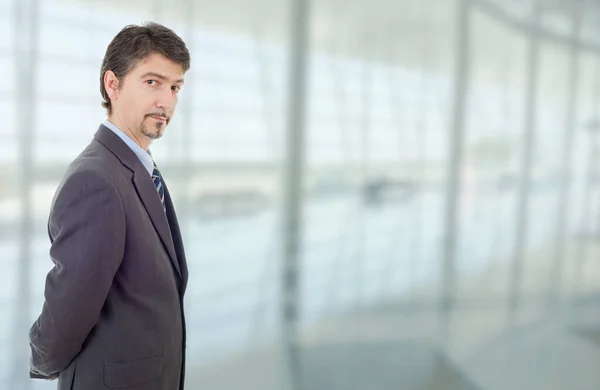 young business man thinking, at the office