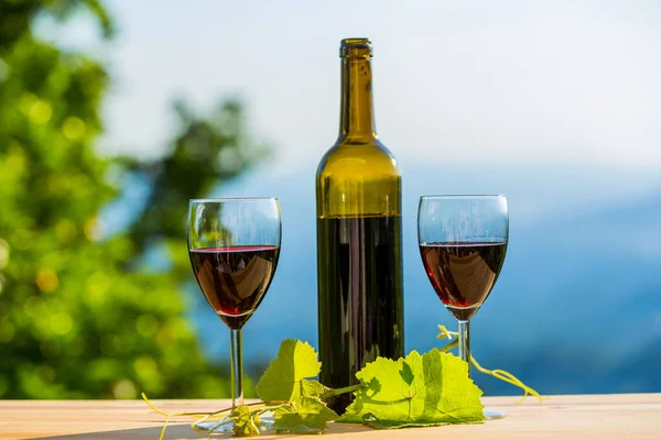 wine bottle on wooden table, outdoor
