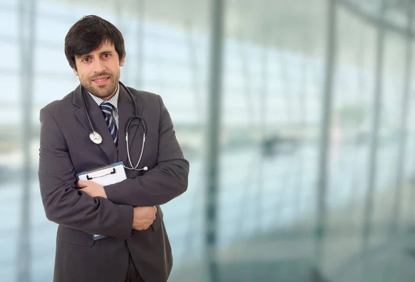 happy male doctor, at the hospital