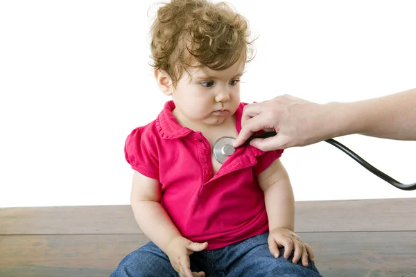 Baby at the doctor Stock Image