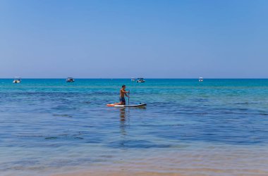 Sicily, Italy: People kayaking in the clear waters near Scala dei Turchi (Stair of the Turks), Sicily, Italy