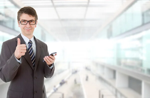 Young business man going thumbs up, at the office — Stock Photo, Image