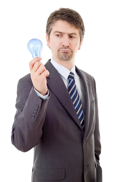 Silly business man with a lamp isolated on white — Stock Photo, Image