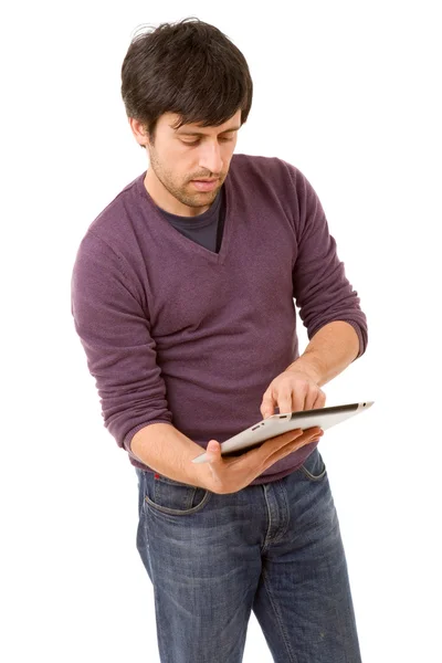 Casual young man using digital tablet isolated on white background — Stock Photo, Image