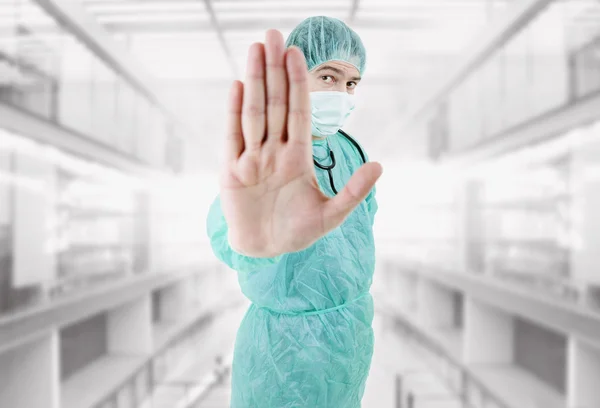 Young male doctor going stop with his hand at the hospital — Stock Photo, Image