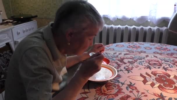 The elderly woman eats soup — Stock Video