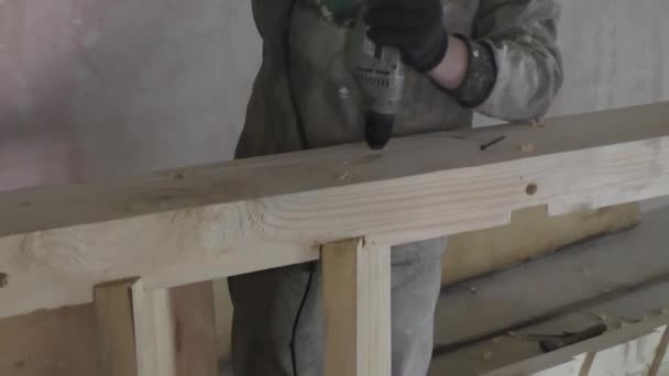 Man turns the screw a Board drill — Stock Video