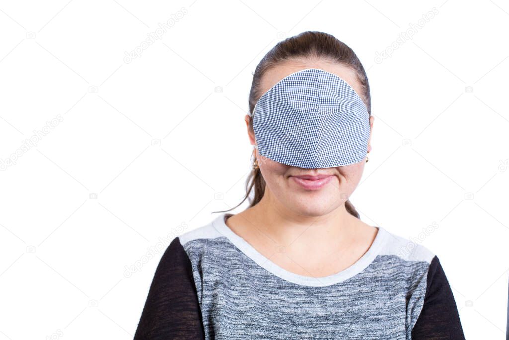 Young girl wear on mask on her eyes, like the way to ignoring quarantine.
