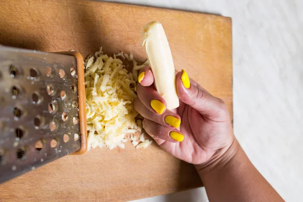 Young Female Hand Holding Piece Cheese Grater Close Kitchen Board — Stock Photo, Image