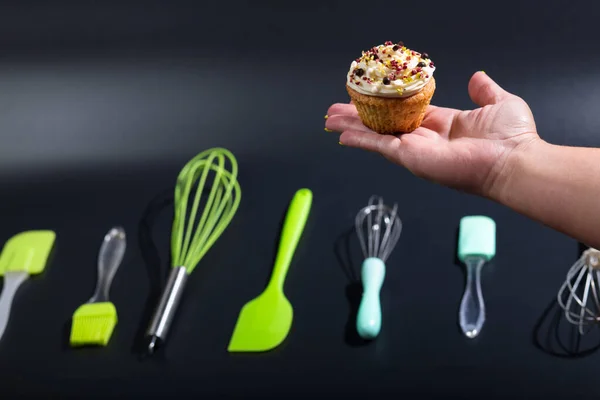 Female Hand Cup Cake Tools Pastry Chef Black Background — Stock Photo, Image