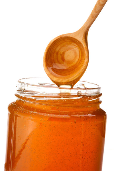 Honey dripping from dipper