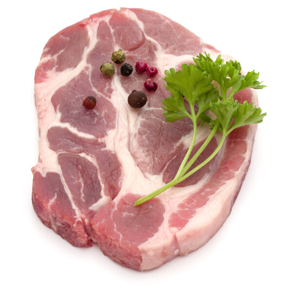 Raw pork neck chop meat with parsley 