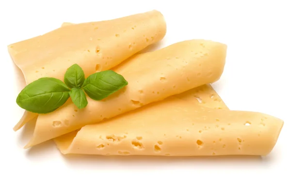 Cheese slices and basil herb leaves — Stock Photo, Image