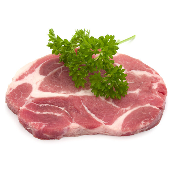 Raw pork neck chop meat with parsley
