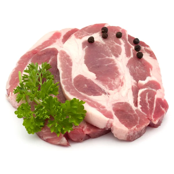 Carne di costoletta di maiale cruda con prezzemolo — Foto Stock