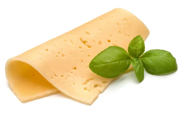 Cheese slice and basil herb leaves — Stock Photo, Image