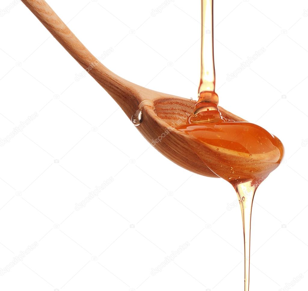 Honey dripping from spoon