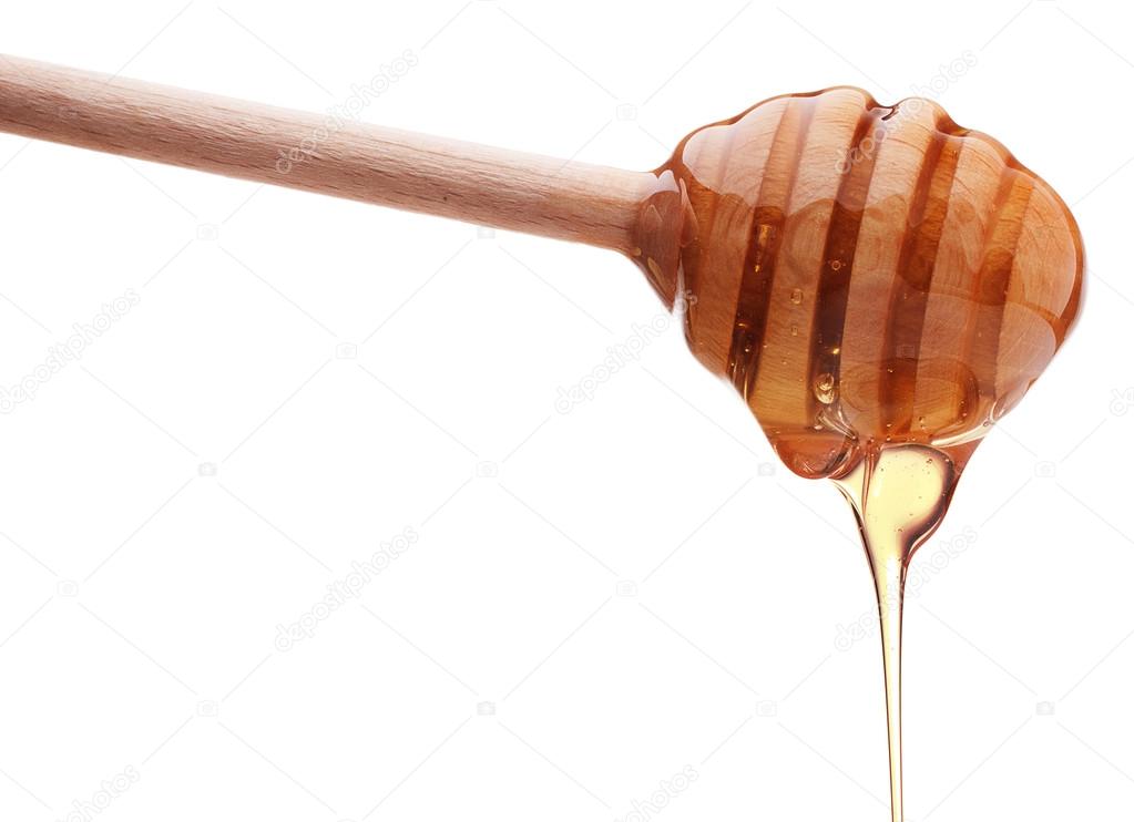 Honey dripping from a honey dipper Stock Photo by ©natika 124940020