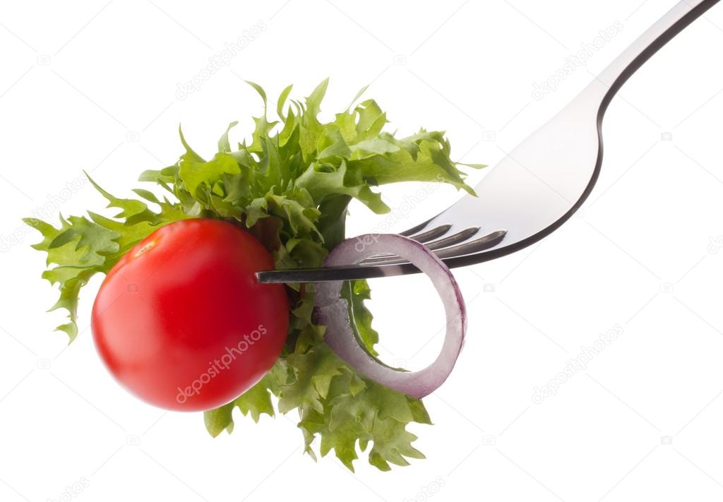 Fresh salad and cherry tomato on fork