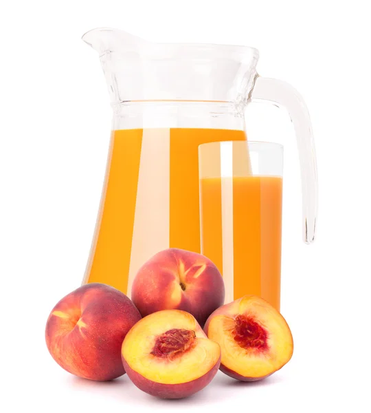 Peach fruit and juice in glass jug — Stock Photo, Image