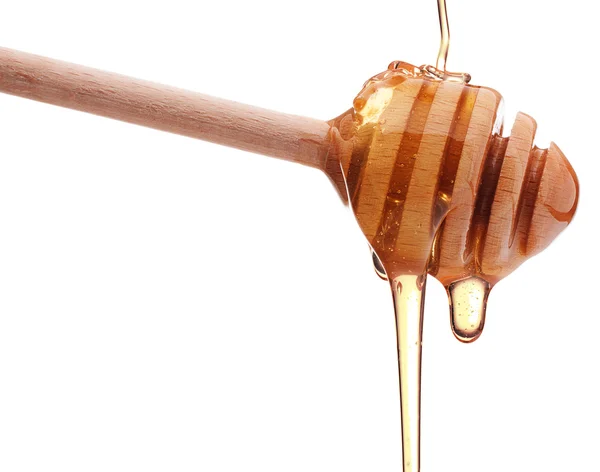 Honey dripping from  honey dipper — Stock Photo, Image