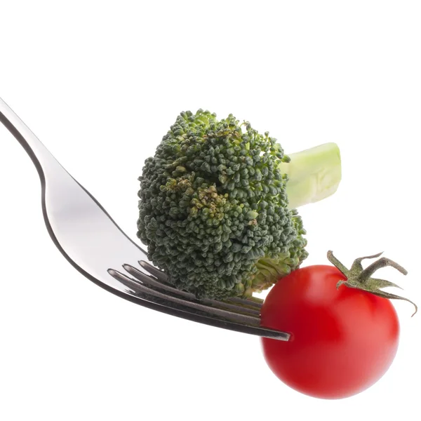 Brócoli y tomate cherry en tenedor —  Fotos de Stock