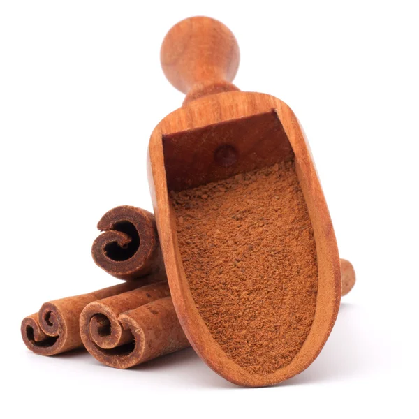 Ground cinnamon powder in spoon — Stock Photo, Image
