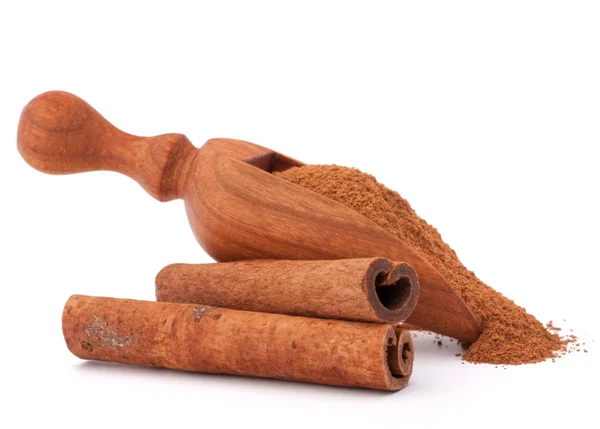 Ground cinnamon powder in spoon — Stock Photo, Image