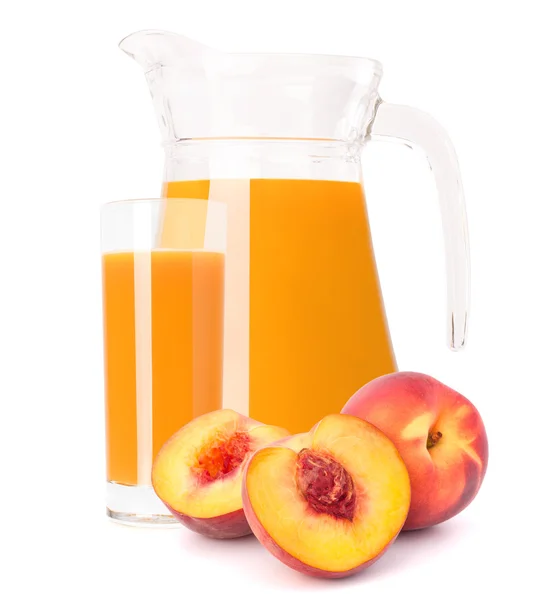 Peach fruit juice in glass jug — Stock Photo, Image