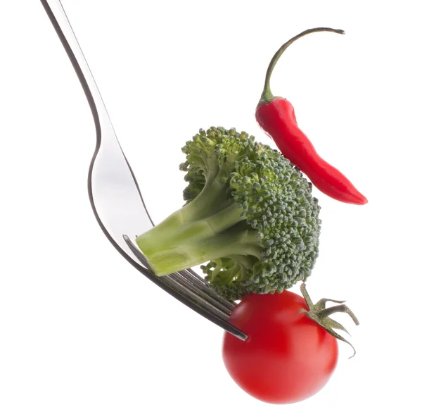 Fresh raw vegetables on fork — Stock Photo, Image