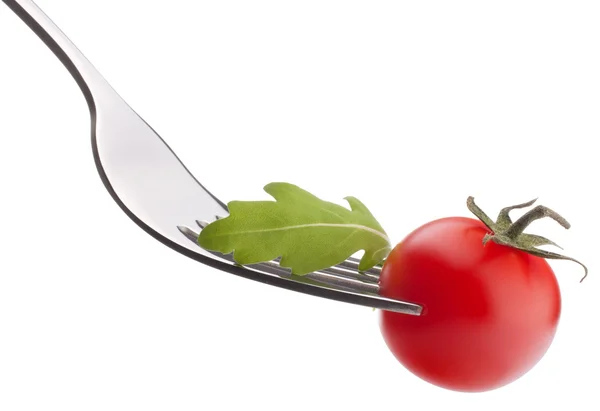在叉上的芝麻菜和樱桃番茄 — 图库照片