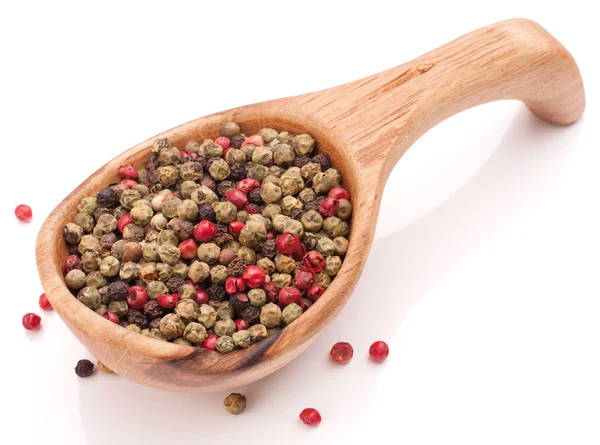 Peppercorn mix in wooden spoon — Stock Photo, Image